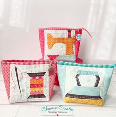 three small zippered pouchs with sewing tools in them on a white table top