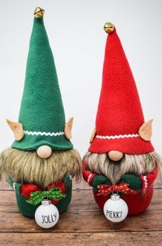 two christmas gnomes sitting next to each other