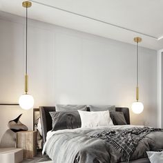 a large bed sitting next to two lamps in a bedroom on top of a hard wood floor