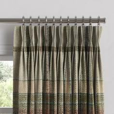 a window curtain with a plaid pattern on it