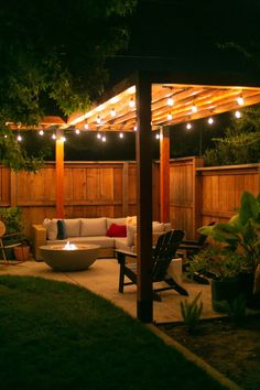 an outdoor living area lit up at night