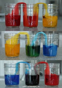 four different colors of liquid in glass jars