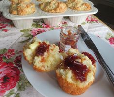 muffins with jam and butter on a plate