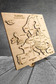 a wooden puzzle with the map of europe on it