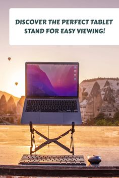 an open laptop computer sitting on top of a wooden table with the words, discovery the perfect tablet stand for easy viewing