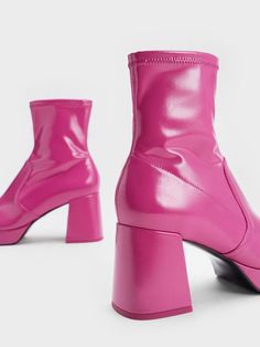 Bold and feminine, these fuchsia patent boots will definitely turn heads. The sleek high-cut ankle boots will have a leg-lengthening effect on all your fall ensembles, while the vibrant pink finish makes a striking statement. Balancing out the Barbiecore aesthetic are the strong angular lines - trapeze block heels complement the squared-toed silhouette. Stitch-trim detailings and a glossy finish add further textural interest while still looking polished and chic. The side-zips on this distinctive pair make them a breeze to put on and take off. Barbiecore Aesthetic, Patent Boots, Red Boots, Block Heel Boots, Charles Keith, High Cut, Clothes Accessories, Heeled Boots, Block Heels