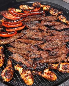 steaks and hot dogs are cooking on the grill