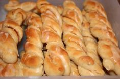 there are many pretzels in the box ready to be baked into breads