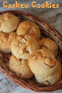 a basket filled with cookies sitting on top of a marble counter next to the words cashew cookies