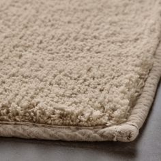 a close up view of a rug on the floor with no carpeting or furniture