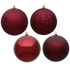 three shiny red christmas ornaments on white background