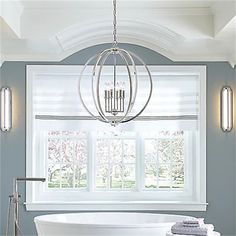 a white bath tub sitting under a window