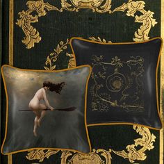 two decorative pillows with an image of a naked woman