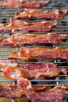 bacon is cooking on the grill and being cooked