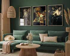 a living room with green walls and paintings on the wall, including a blue couch