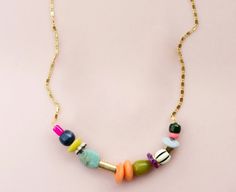 Colorful vibrant beaded gold chain filled necklace Multicolor Bohemian Necklace With Round Beads, Multicolor Beaded Chain Necklace For Gift, Multicolor Beaded Chain Necklace As Gift, Multicolor Beaded Chain Necklace Gift, Bohemian Chain Necklace With Colorful Beads For Jewelry Making, Adjustable Chain Necklace With Colorful Round Beads, Gold Chain Necklace With Colorful Beads, Handmade Multicolor Chain Necklace With Round Beads, Multicolor Beaded Chain For Jewelry Making