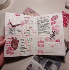 someone is holding an open valentine's day card with pictures and hearts on it