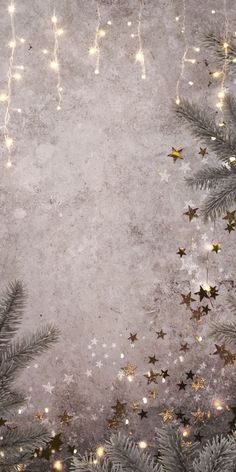 a christmas background with gold stars and tinsel