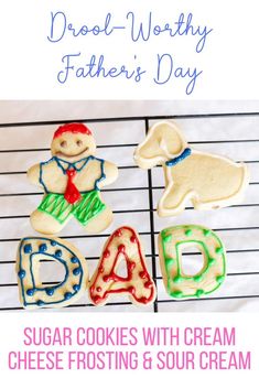 sugar cookies with cream cheese frosting and sour cream for father's day on a cooling rack