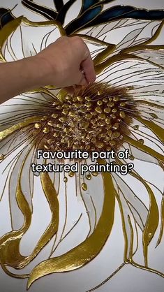 a person is painting a flower with gold paint on it and the words, favorite part of textured painting?