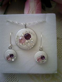 a necklace and earring set with pink stones