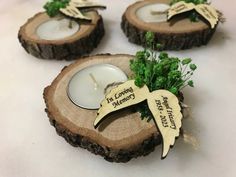 three wooden slices with candles on them