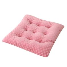 a pink square cushion with checkered pattern on the front and back, sitting on a white background