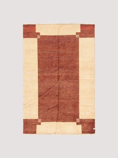 a brown and white rug with squares on it