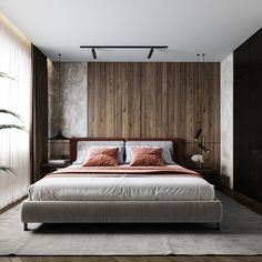 a large bed sitting in the middle of a bedroom next to a tall wooden wall