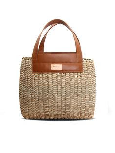 Make even the most relaxed outfits that little bit more chic with this basket bag by Khokho Collection. It’s handwoven by the brand’s all-female team of artisans from locally-sourced natural fibers and finished with tan leather handles and trims. Wear yours with a lightweight linen suit as soon as the weather heats up. - Top handles, open top - Natural fibers, cow leather - Any variations in tone or texture are inherent to the handcrafted nature of each bag - Artisanally crafted by a local femal Handwoven Rattan Straw Bag, Relaxed Outfits, African Luxury, Relaxed Outfit, Linen Suit, Basket Bag, Summer Staples, Matching Necklaces, Open Top