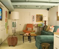 a living room filled with furniture and a flat screen tv mounted to the wall above it