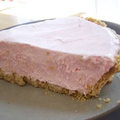 a piece of cake with pink frosting on it