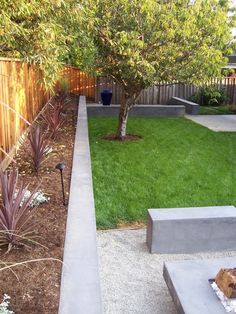 an image of a backyard with concrete benches