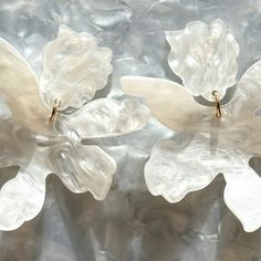 These lightweight acrylic flower drop earrings are featured in a sleek white hand-swirled acrylic. You'll be sure to turn heads with these garden party perfect paper lily flower earrings! Details: ▪️Length: 2.75", Width: 2"▪️Materials: acrylic, brass base posts/jump rings with 18k gold plating▪️Hypoallergenic ▪️Made in the USA (Pittsburgh, PA) All earrings have specialized backs to maintain their integrity. As with all fused materials, please be mindful of your use of force and handle carefully. Paper Lily Flower, Paper Lily, Lily Earrings, Flower Drop Earrings, Summer Color Palette, Acrylic Flower, Stocking Fillers For Her, Mini Hoop Earrings, Forever Jewelry