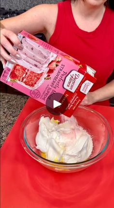 a woman is mixing ingredients in a bowl