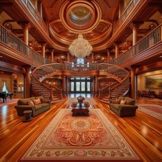 a large living room with wooden floors and chandelier