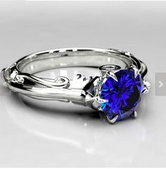 a ring with a blue stone in the center