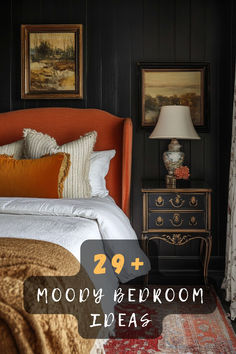 a bedroom with black walls and white bedding has an orange headboard on it