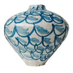 a blue and white vase is shown against a white background