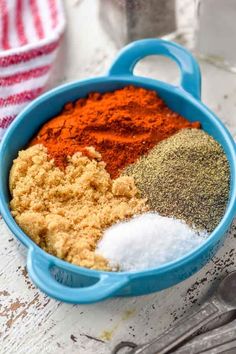 various spices and seasonings in a blue bowl