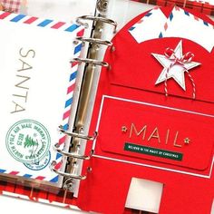 an open red and white mail box with the word mail on it