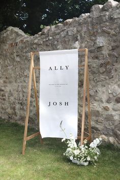 a sign that says, ally and joseph on it in front of a stone wall