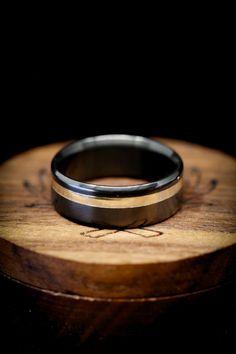 a wedding ring sitting on top of a wooden table