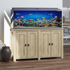 a fish tank sitting on top of a wooden cabinet