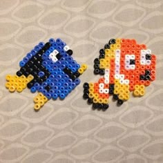 two pieces of lego art made to look like pacman and princess peach from the nintendo video game