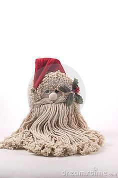 a mop with a santa claus hat on it's head is sitting in front of a white background