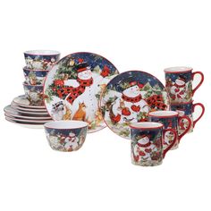 a set of christmas themed dishes and cups