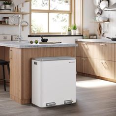 a white dishwasher sitting in the middle of a kitchen next to a window