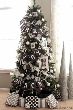 a black and white christmas tree decorated with ornaments