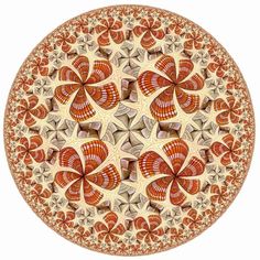 an orange and white circular design with flowers on it's center, surrounded by smaller circles